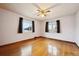 Bedroom featuring hardwood floors, large windows and ceiling fan at 2301 Vine St, Denver, CO 80205