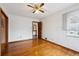 Bright bedroom with hardwood floors, ceiling fan, and natural light at 2301 Vine St, Denver, CO 80205