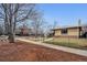Front exterior of a one story house featuring brick and a chain link fence at 2301 Vine St, Denver, CO 80205