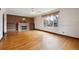 Bright living room featuring hardwood floors, a fireplace, and large window at 2301 Vine St, Denver, CO 80205