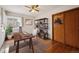 Home office space with hardwood floors, ample light, desk, and shelving at 2301 Vine St, Denver, CO 80205