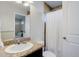 Bright bathroom featuring a granite counter, tiled shower with white curtain, and a view of a bedroom at 3733 S Perth Cir # 101, Aurora, CO 80013