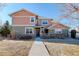 Charming two-story home featuring a mix of siding and stonework on the facade with a walkway to the front door at 3733 S Perth Cir # 101, Aurora, CO 80013