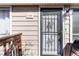 The front entrance has a decorative security door with a white painted door and dark hardware at 1135 S Oneida St # F, Denver, CO 80224