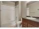 Clean bathroom with shower/tub combo and vanity at 12444 Madison Way, Thornton, CO 80241