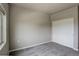 This bedroom features soft carpeting, neutral walls, and a closet with sliding doors at 12444 Madison Way, Thornton, CO 80241