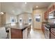 Kitchen island with granite countertop and seating for two at 12444 Madison Way, Thornton, CO 80241