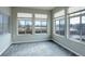 Bright sun room with large windows offering scenic views and filling the space with natural light at 12444 Madison Way, Thornton, CO 80241