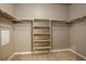 Large walk-in closet with shelving and hanging rods at 12444 Madison Way, Thornton, CO 80241