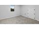 Small bedroom with window and built-in storage at 2610 W 90Th Pl, Denver, CO 80260