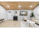 Living room with hardwood floors, vaulted ceiling, and large window at 2610 W 90Th Pl, Denver, CO 80260