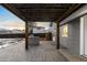 Covered patio with stamped concrete and a built-in grill at 2610 W 90Th Pl, Denver, CO 80260