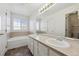 Bathroom features double vanity and soaking tub at 5928 E Conservation Dr, Frederick, CO 80504