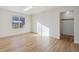 Light-filled bedroom with hardwood floors and a closet at 5928 E Conservation Dr, Frederick, CO 80504