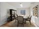 Formal dining room showcasing a modern chandelier, seating for six, and decorative wall art at 5928 E Conservation Dr, Frederick, CO 80504