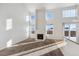 Living room with hardwood floors, fireplace and large windows at 5928 E Conservation Dr, Frederick, CO 80504