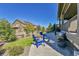 Inviting backyard patio featuring a cozy fire pit and comfortable seating, perfect for outdoor entertaining at 8259 Arapahoe Peak St, Littleton, CO 80125