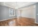 Inviting entryway with hardwood floors, chandelier, and plenty of natural light at 8259 Arapahoe Peak St, Littleton, CO 80125