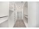 Spacious walk-in closet with custom shelving and ample storage space at 8259 Arapahoe Peak St, Littleton, CO 80125