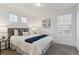 Bedroom with carpet, white walls, a window, a queen bed and a painting above the bed at 645 Flintwood Pl, Lafayette, CO 80026
