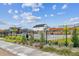 Community pool area with landscaping, a pergola and fencing at 645 Flintwood Pl, Lafayette, CO 80026