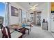 Bright dining area with large windows, a modern ceiling fan, and lots of light at 9518 W San Juan Cir # 307, Littleton, CO 80128