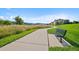 Scenic walking path with bench seating, surrounded by nature and providing community gathering at 9518 W San Juan Cir # 307, Littleton, CO 80128