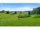 Beautiful community grounds showcasing a well-manicured green space with trees and manicured creek area at 9518 W San Juan Cir # 307, Littleton, CO 80128