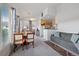 Open-concept living space with dining area, sofa and lots of natural light at 9518 W San Juan Cir # 307, Littleton, CO 80128