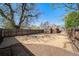 Expansive backyard featuring new sod, privacy fence, and mature trees; perfect for outdoor entertaining at 7275 E 8Th Ave, Denver, CO 80220