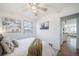 Comfortable bedroom with a large window, natural light, and doorway to living space at 7275 E 8Th Ave, Denver, CO 80220