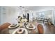Open-concept dining area flowing into a stylish living room and modern kitchen at 7275 E 8Th Ave, Denver, CO 80220