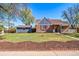 Charming brick home with a well-manicured lawn and detached garage at 7275 E 8Th Ave, Denver, CO 80220