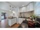 Well-designed kitchen featuring modern appliances and a view to the dining room at 7275 E 8Th Ave, Denver, CO 80220