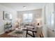 Cozy living room with neutral décor, a patterned rug, and bright natural light at 7275 E 8Th Ave, Denver, CO 80220