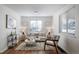 Cozy living room with hardwood floors, stylish decor, and ample natural light at 7275 E 8Th Ave, Denver, CO 80220