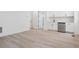 Clean bar area with white cabinets, stainless steel beverage fridge, and modern design at 8386 Cokedale Cir, Littleton, CO 80125