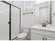 Modern bathroom with a sleek glass shower and white vanity at 8386 Cokedale Cir, Littleton, CO 80125
