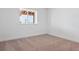 Bedroom featuring one window, neutral carpet, baseboards, and white walls at 8386 Cokedale Cir, Littleton, CO 80125