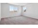 Bright bedroom with neutral carpet and large windows at 8386 Cokedale Cir, Littleton, CO 80125