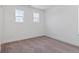 Bright bedroom featuring large windows and neutral carpet at 8386 Cokedale Cir, Littleton, CO 80125