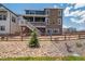 Beautiful stone-clad home with a second-story deck and fenced backyard at 8386 Cokedale Cir, Littleton, CO 80125