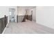 Open hallway with neutral carpet and wood railing at 8386 Cokedale Cir, Littleton, CO 80125