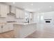 Modern kitchen with island and stainless steel appliances in an open floor plan at 8386 Cokedale Cir, Littleton, CO 80125