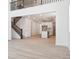 Spacious open living space featuring high ceilings and modern staircase with a loft area at 8386 Cokedale Cir, Littleton, CO 80125