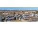Expansive aerial view of a quiet neighborhood nestled against a backdrop of stunning mountain views at 4217 S Jericho St, Aurora, CO 80013