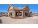 Beautiful community center building with stone architecture, open spaces, and picnic tables at 4217 S Jericho St, Aurora, CO 80013