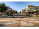 Beautiful pedestrian community area featuring decorative pavers, mature trees, and various shops and businesses in a desirable location at 4217 S Jericho St, Aurora, CO 80013
