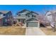 Charming two-story home with well-maintained landscaping, a two-car garage, and a welcoming front porch at 4217 S Jericho St, Aurora, CO 80013