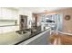 Modern kitchen featuring stainless steel appliances, sleek countertops, and a bright breakfast nook at 4217 S Jericho St, Aurora, CO 80013